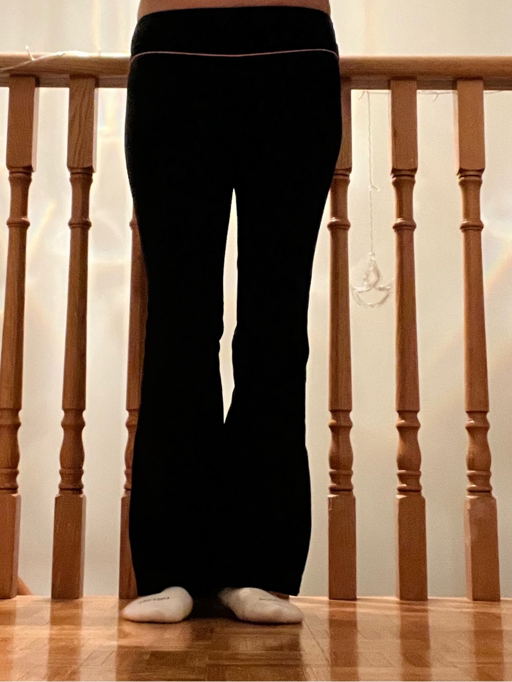 TNA Black Flare Yoga Pants with Subtle Pink Waist Trim